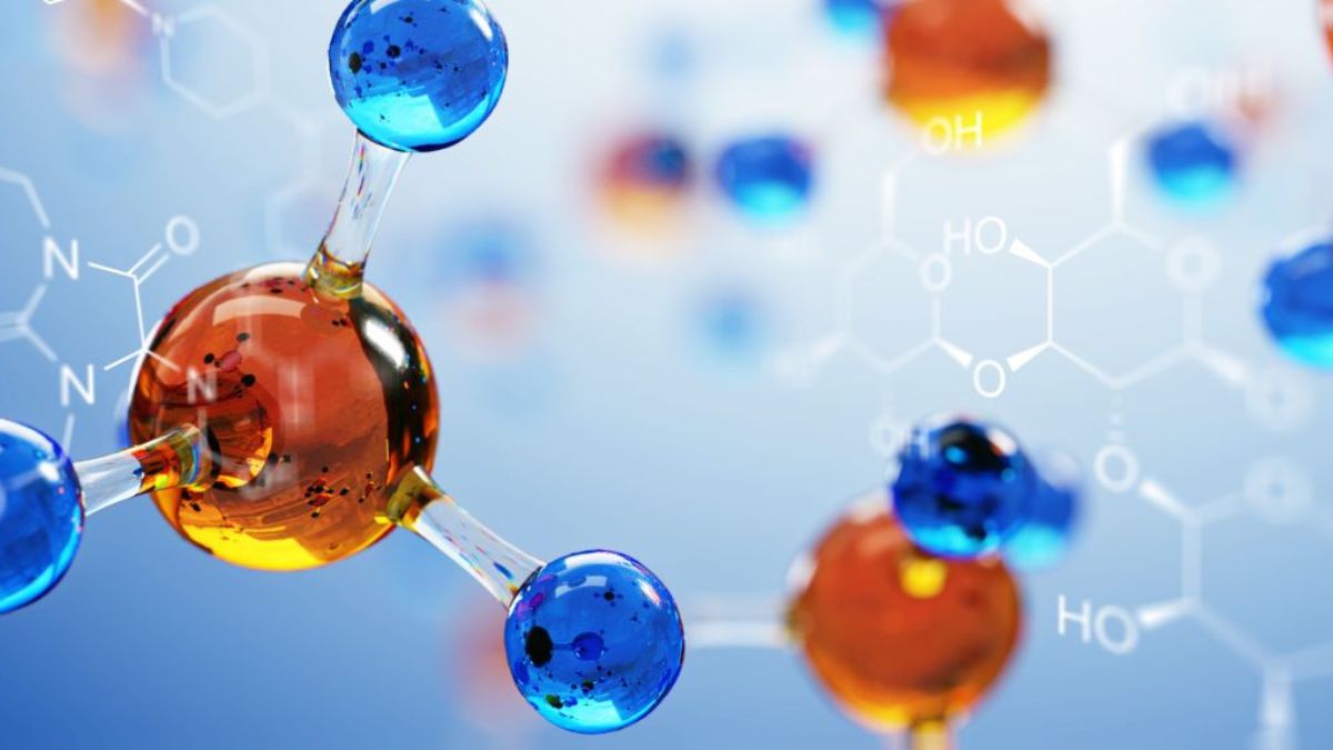 A close-up illustration of colorful molecular structures, featuring blue and orange atoms connected by transparent bonds, set against a blue background with faint chemical formulas.