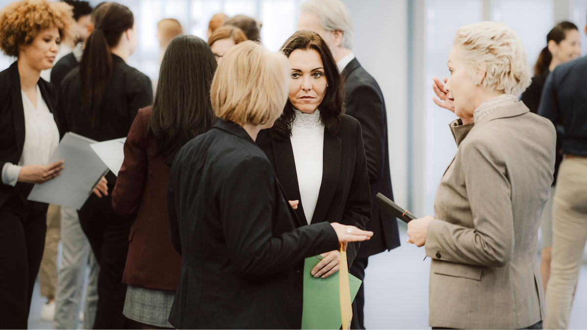 Women standing together talking