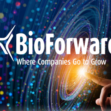 A hand touching a glowing dot with the words: BioForward, where companies go to grow