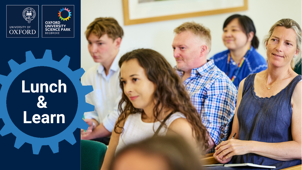 A group of people seated at an event with the wording: Lunch & Learn